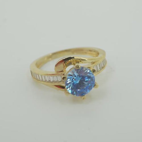 14KT Gold Ring Women's Round Light Blue CZ Center Stone and Single Row White CZ Baguettes with "S" Band