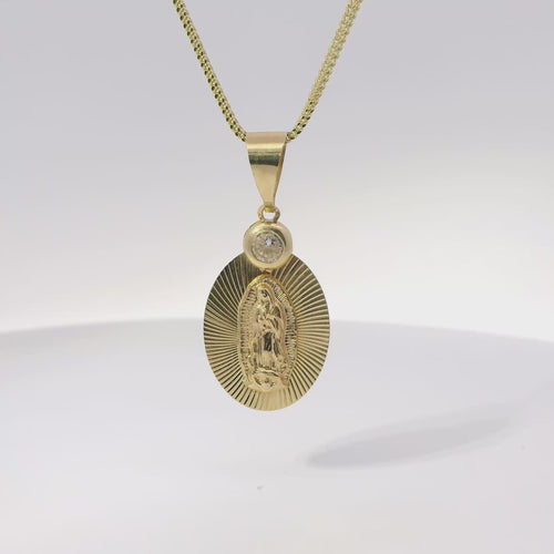 14KT Gold Charm Medium Oval Virgin Mary Sunray Coin with White CZ Stones Top and Plain Bell