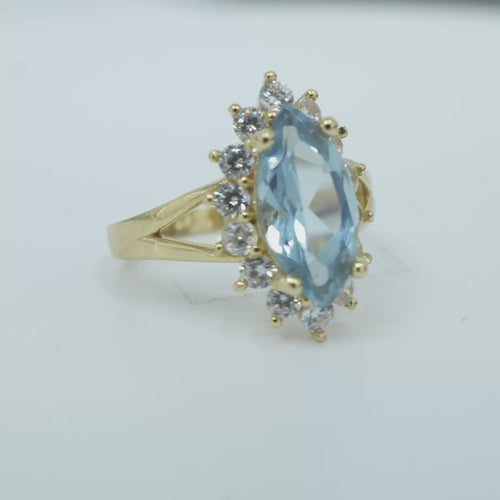 14KT Women's Gold Ring Jumbo Light Blue Marquise Center CZ with Round White CZ Stones Border and Plain Split Band