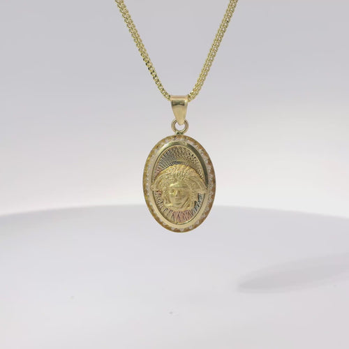 14KT Gold Charm Medium Oval Tri Tone Graphic Line Background with Medusa Center Coin with White CZ Stones Frame Edge and Plain Bell