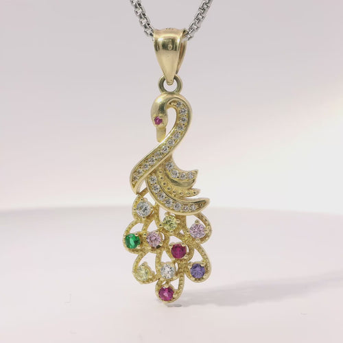 14KT Gold Charm Peacock with Multicolor CZ Stones Tail White CZ Stones Body and Dark Pink CZ Stone Eye and Plain Bell