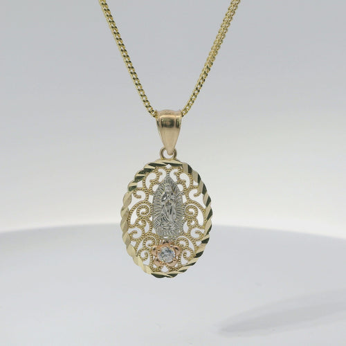 14KT Gold Charm Medium Oval Tri Tone Virgin Mary Swirl Center Diamond Cut Border Coin with White CZ Stone Flower and Plain Bell