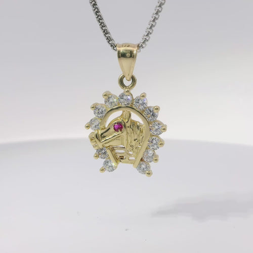 14KT Gold Charm Medium Red Eye Horsehead Center with White CZ Stones Horseshoe Border and Plain Bell