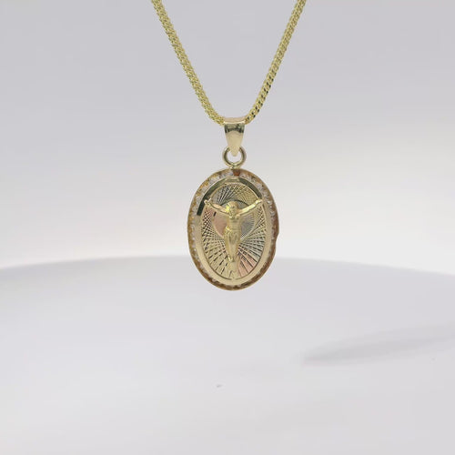 14KT Gold Charm Medium Oval Tri Tone Graphic Line Background with Crucifix Center Coin with White CZ Stones Frame Edge and Plain Bell