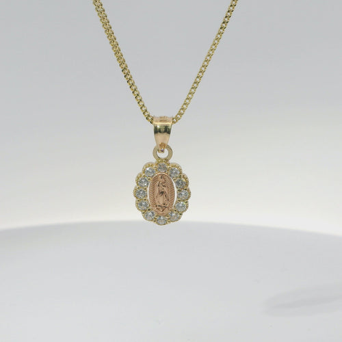 14KT Gold Charm Extra Small Oval Two Tone Virgin Mary Open Center with Scallop White CZ Stones Border and Plain Bell