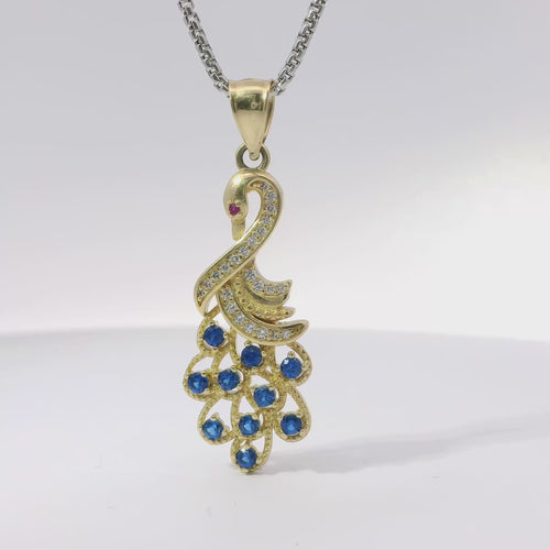 14KT Gold Charm Peacock with Blue CZ Stones Tail, White CZ Stones Body, Dark Pink CZ Stone Eye and Plain Bell