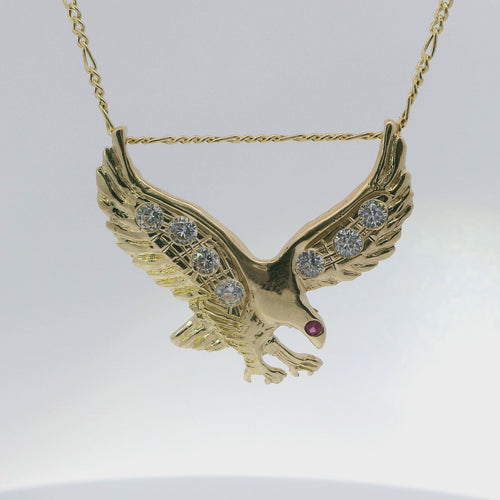 14KT Gold Charm Large Right Facing Soaring Eagle with Round White CZ Stones on Wings, Red CZ Stone Eye, and Plain Bell