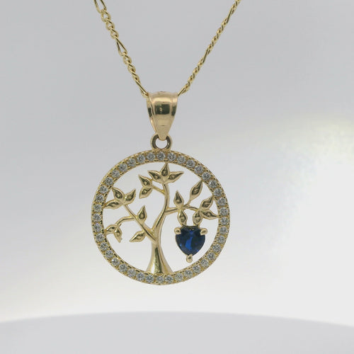 14KT Gold Charm Medium Open Round Tree of Life with White CZ Stones Border, Navy Blue Heart CZ Stone, and Plain Bell