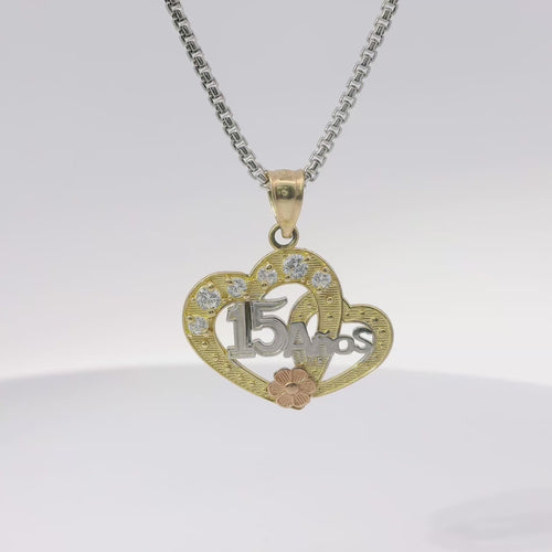 14KT Gold Charm Medium Quincenaera Tri Tone "15 Anos" Center of Two Open Hearts with White CZ Stones Top Border, Flower Base, and Plain Bell
