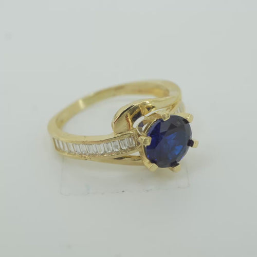 14KT Gold Ring Women's Round Navy Blue CZ Center Stone and Single Row White CZ Baguettes with "S" Band