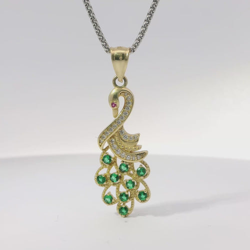 14KT Gold Charm Peacock with Green CZ Stones Tail, White CZ Stones Body, Dark Pink CZ Stone Eye and Plain Bell
